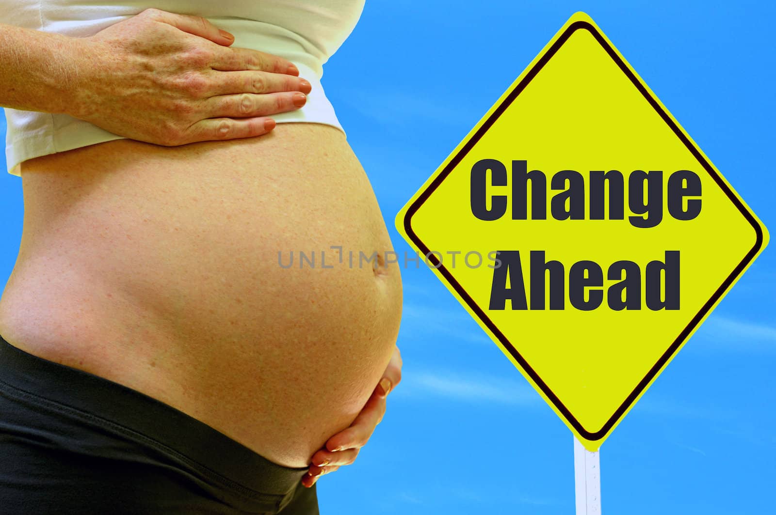 change ahead with expectant mother and street sign