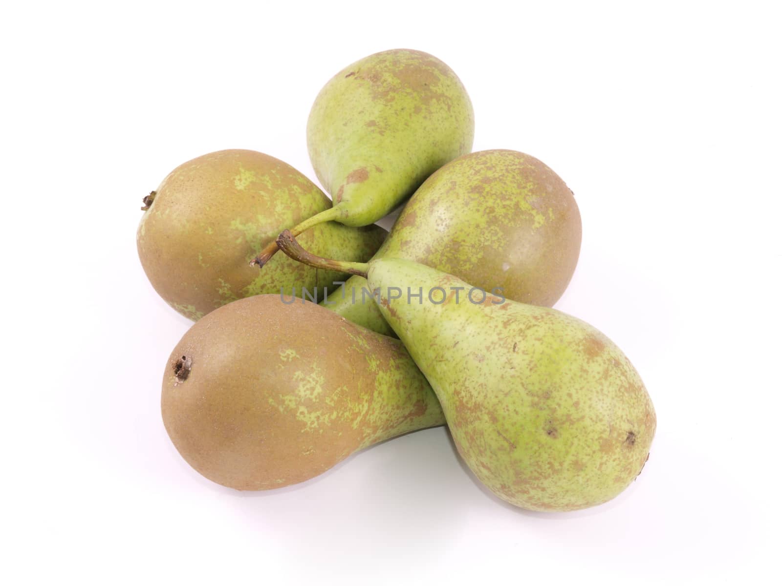 Close up of freshly picked organic pears on a white background.