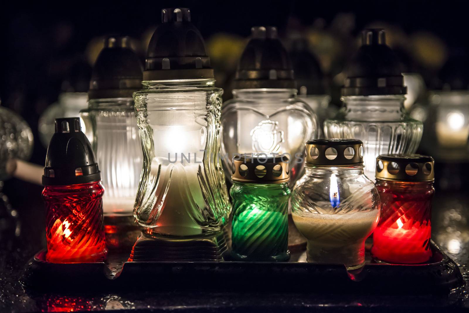 Candles on a grave at night