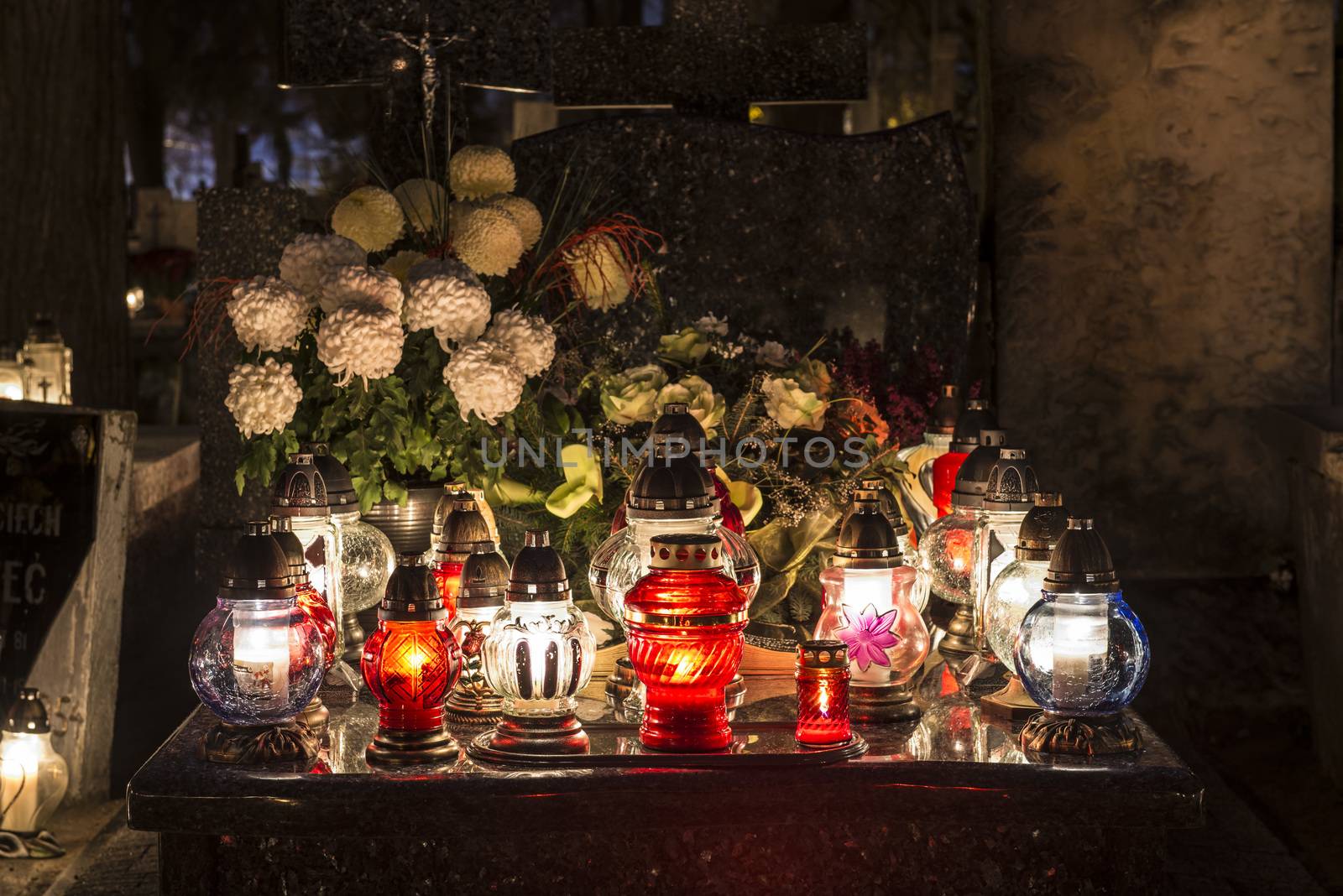 Candles on a grave at night