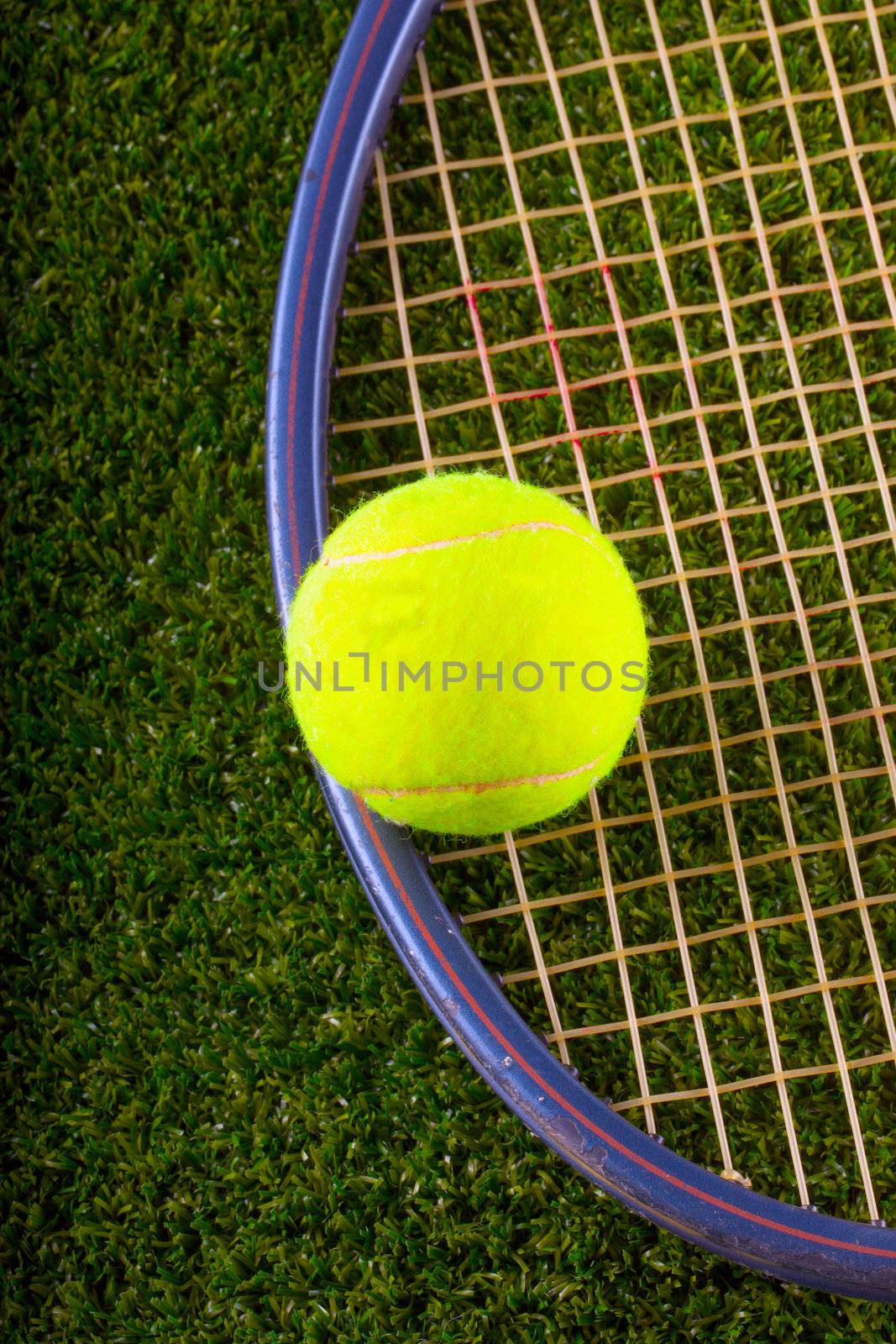 Tennis ball and racket over grass by Koufax73