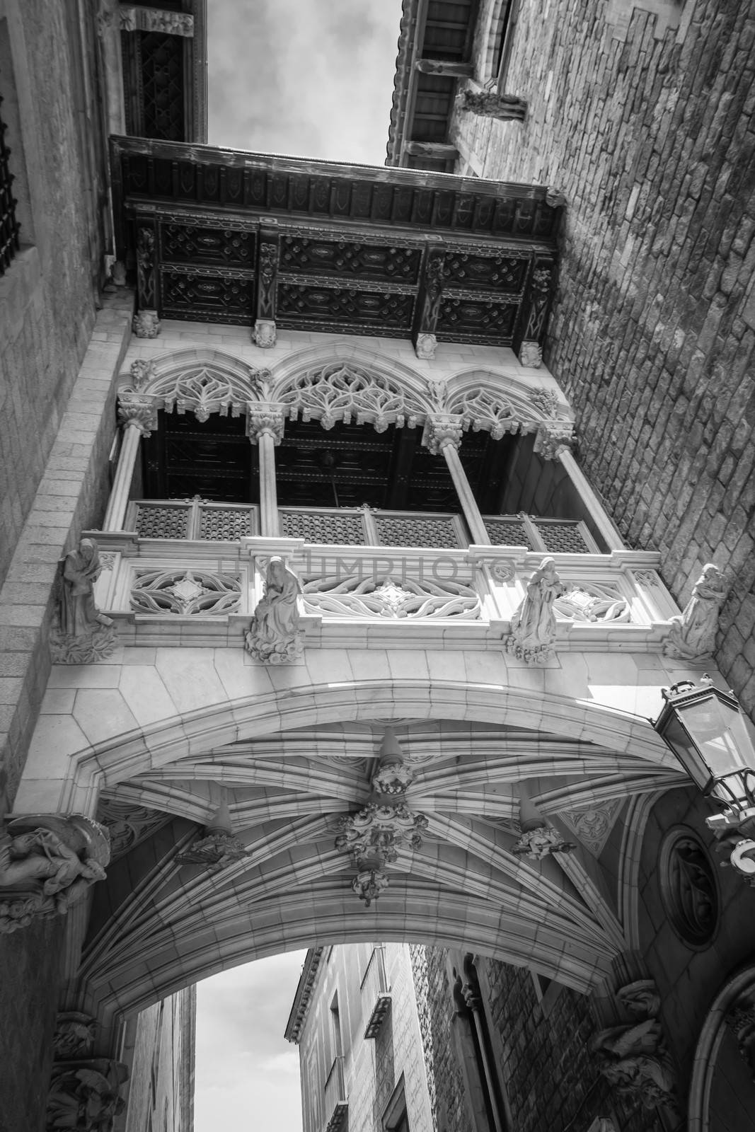 Gothic bridge in Carrer del Bisbe street, in the center of gothic quarter of Barcelona, Spain