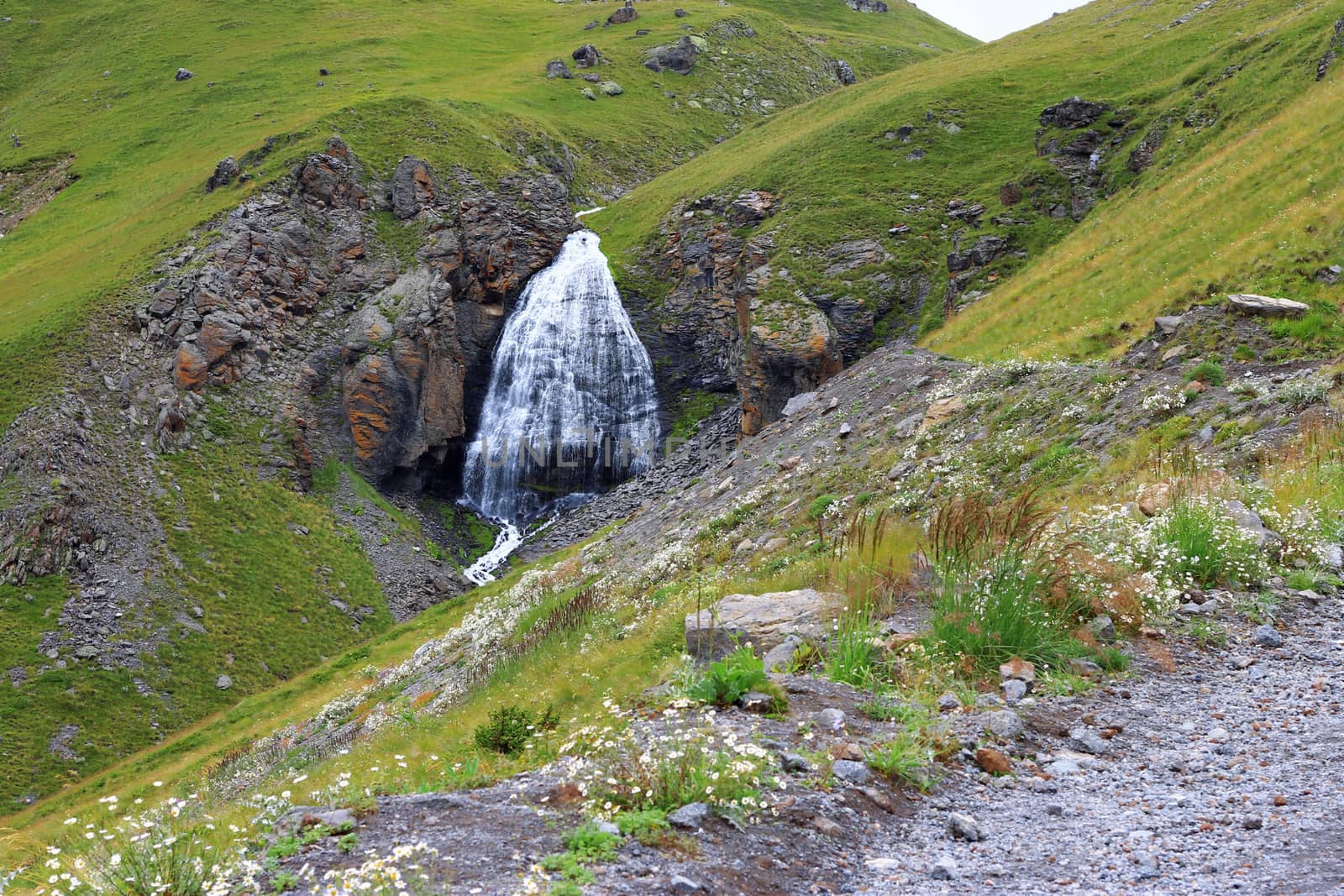 Waterfall Girlish Braids between the mountains of Northern Caucas