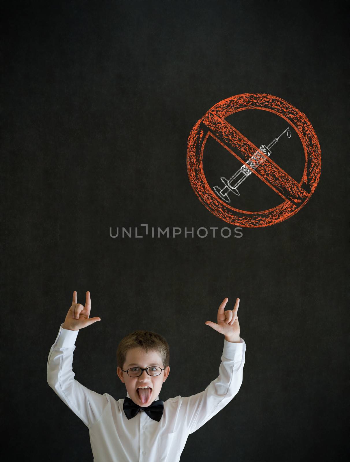 Knowledge rocks boy dressed up as business man with no drugs needle sign on blackboard background
