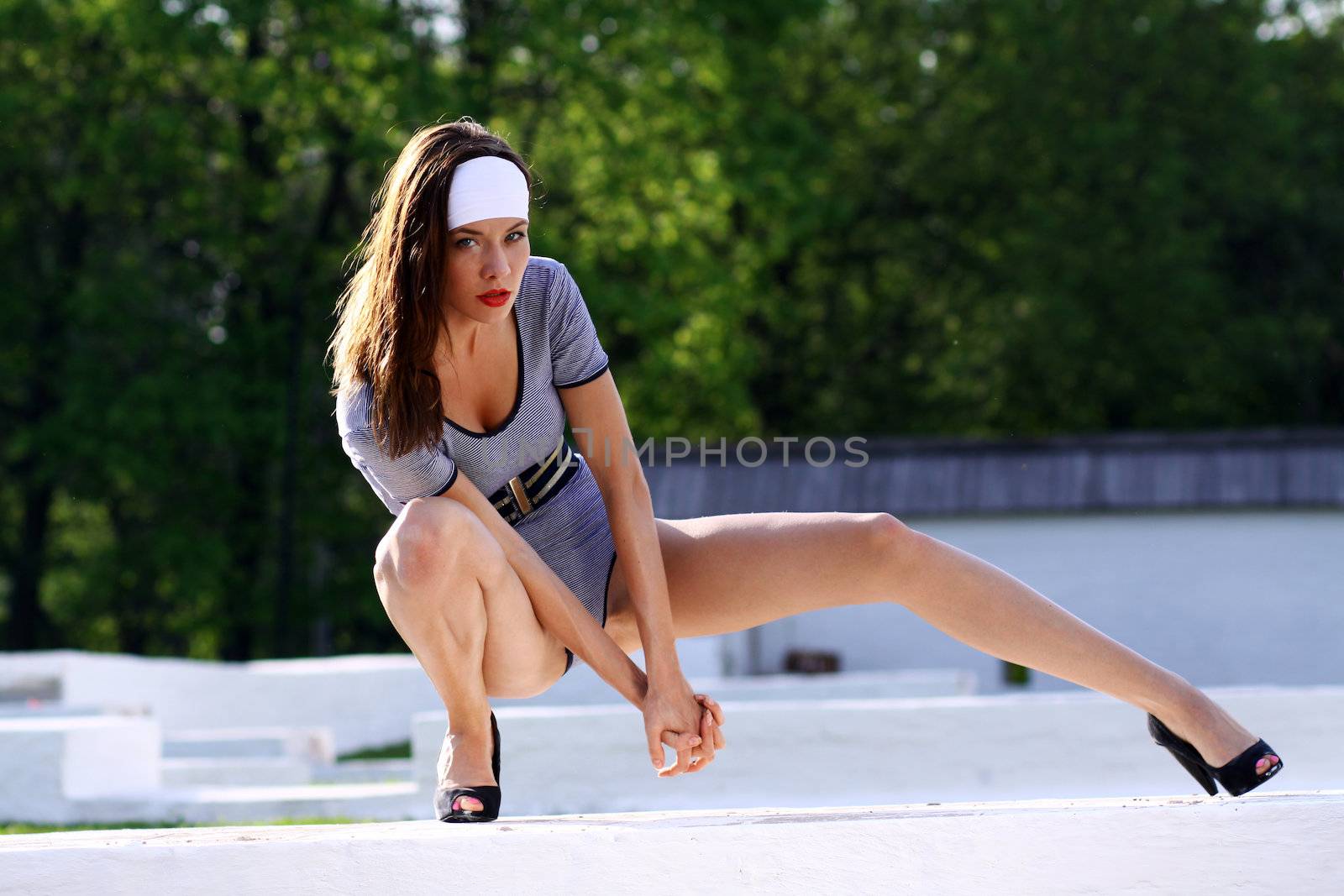 glamour beautiful young model in summer park