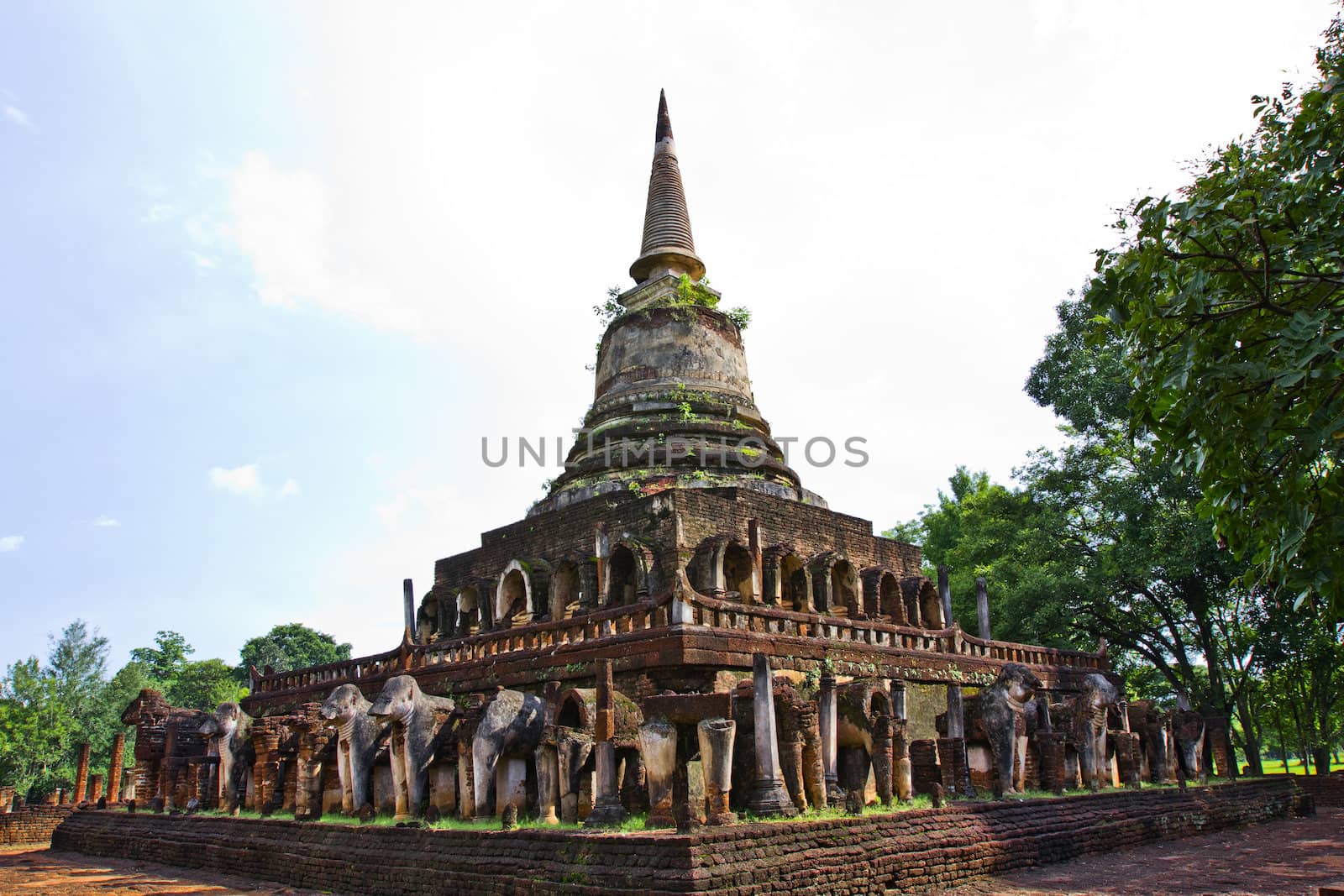 Buddhist stupa surrounding by elephants statue represent the mount meru bearer in Sukhothai province the first capital of Thailand