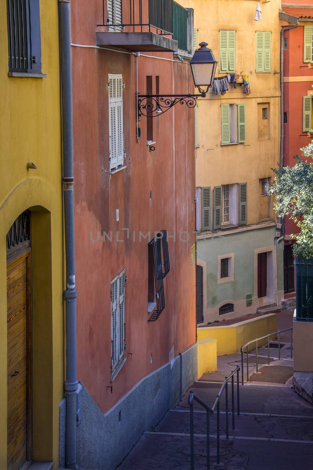A street of colorful houses in the city of Nice on the Cote d'Azur in the South of France.