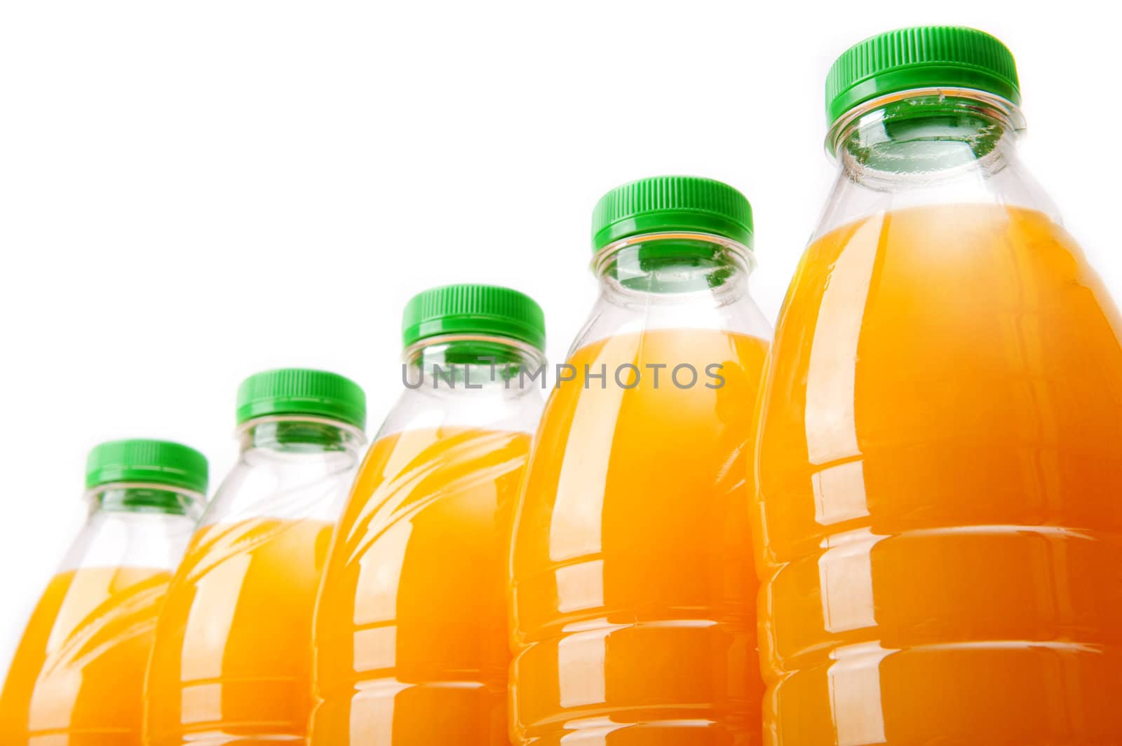 Bottles with fresh orange juice on white background