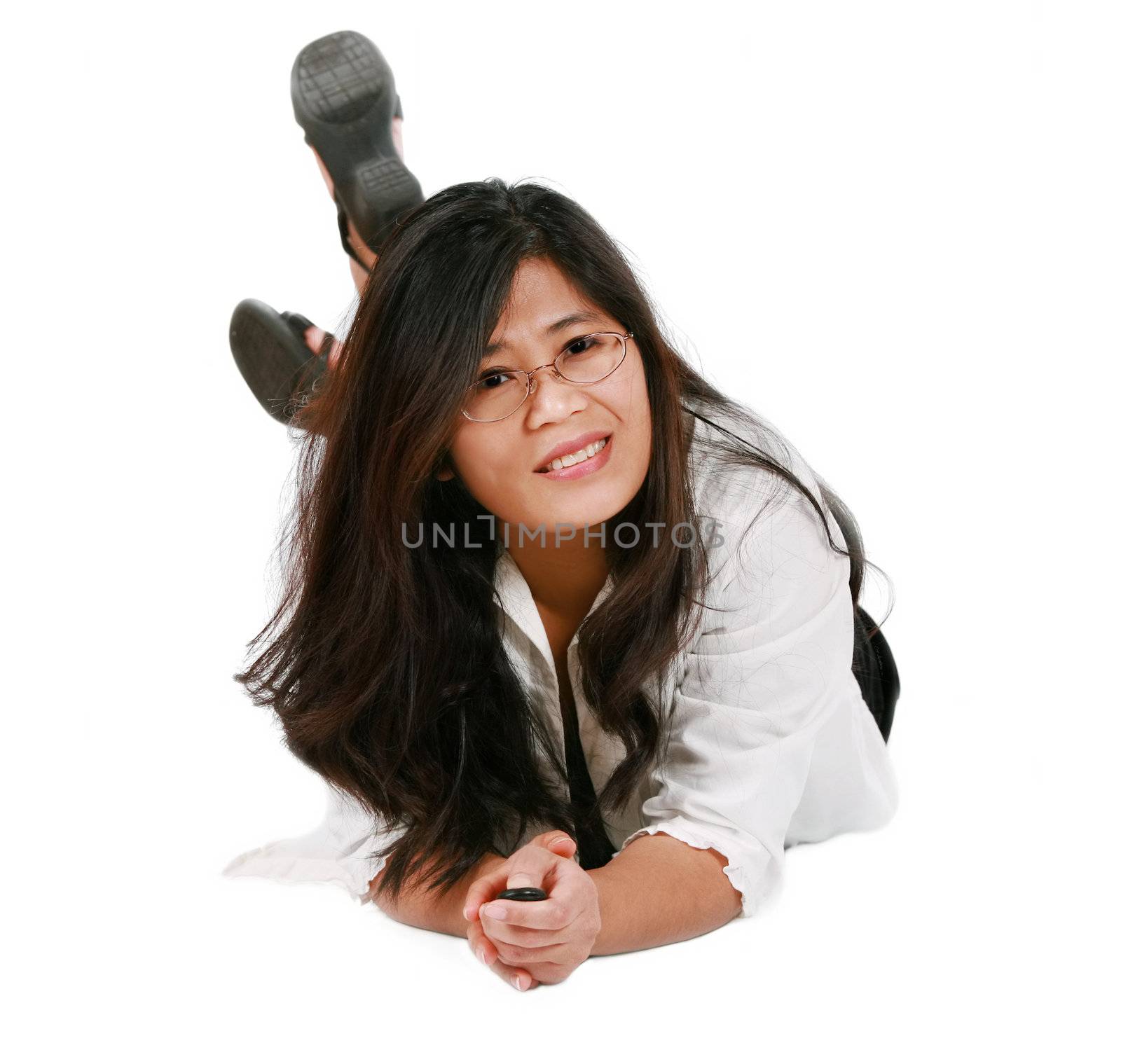 Asian woman lying on floor relaxing, smiling