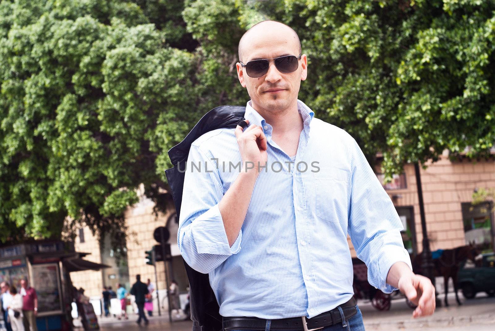 portrait of a attractive gorgeous guy wearing sunglasses by gandolfocannatella
