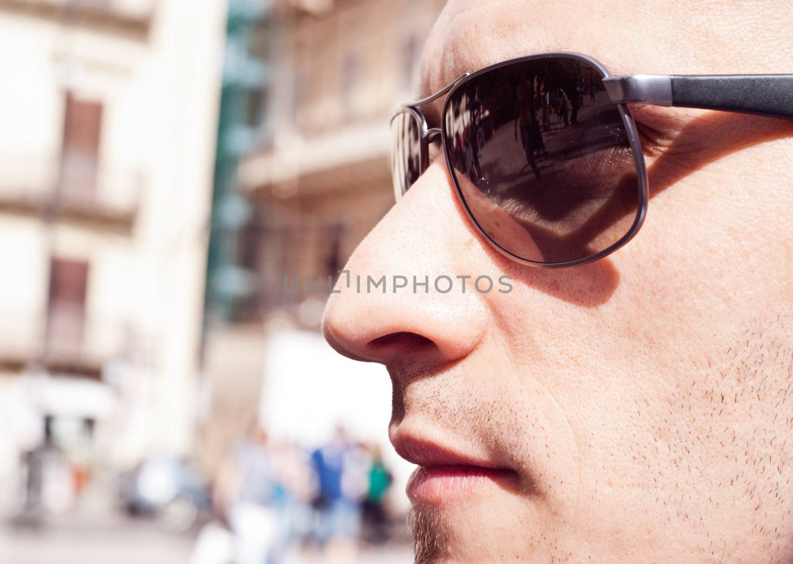 portrait of a attractive gorgeous guy wearing sunglasses by gandolfocannatella