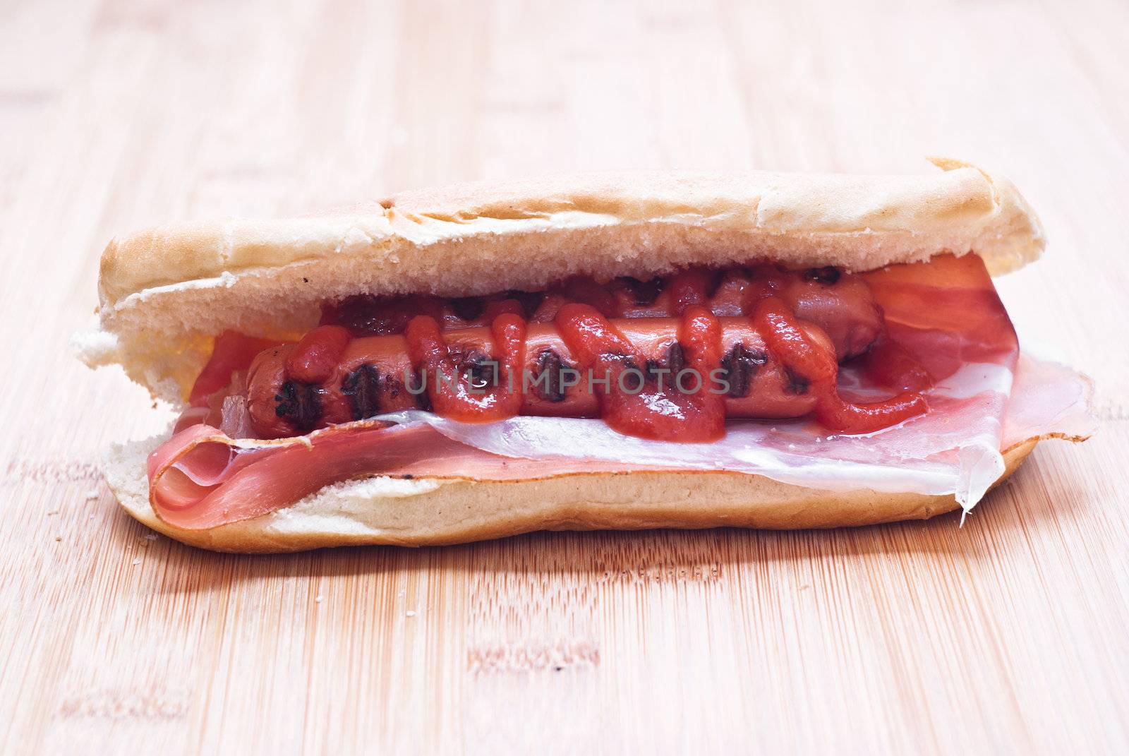 Appetizing hot dog on wooden board