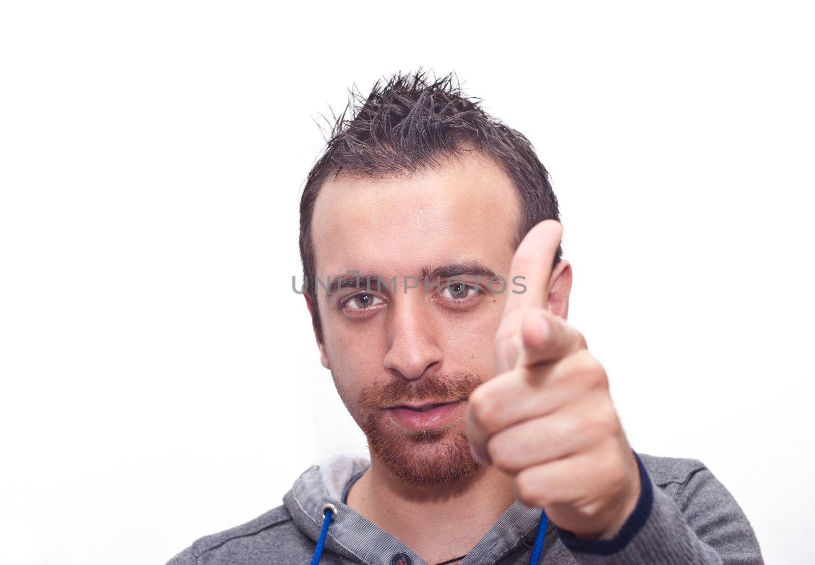 Young man pointing with fingers on white background