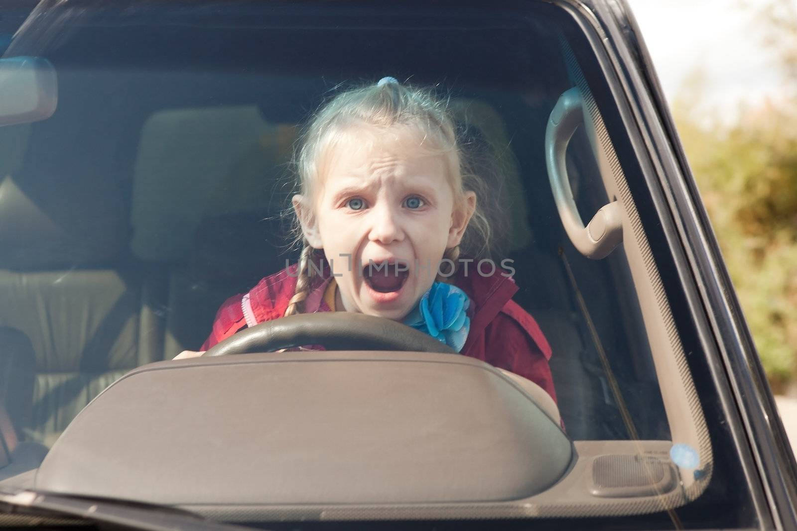 Crying scared girl in the car by vsurkov