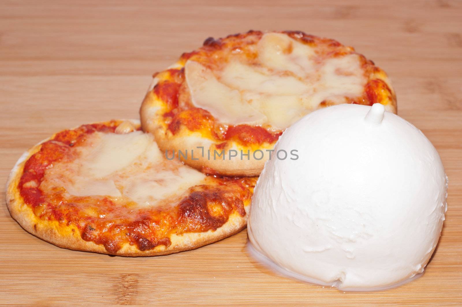 closeup of mini pizza with mozzarella