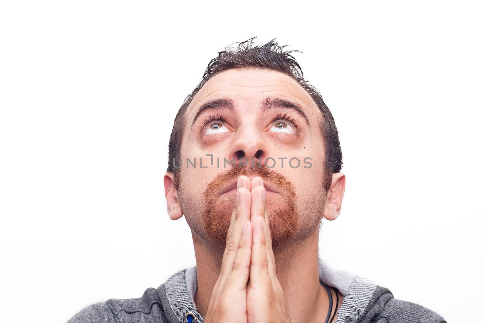 Close up man praying and looking up