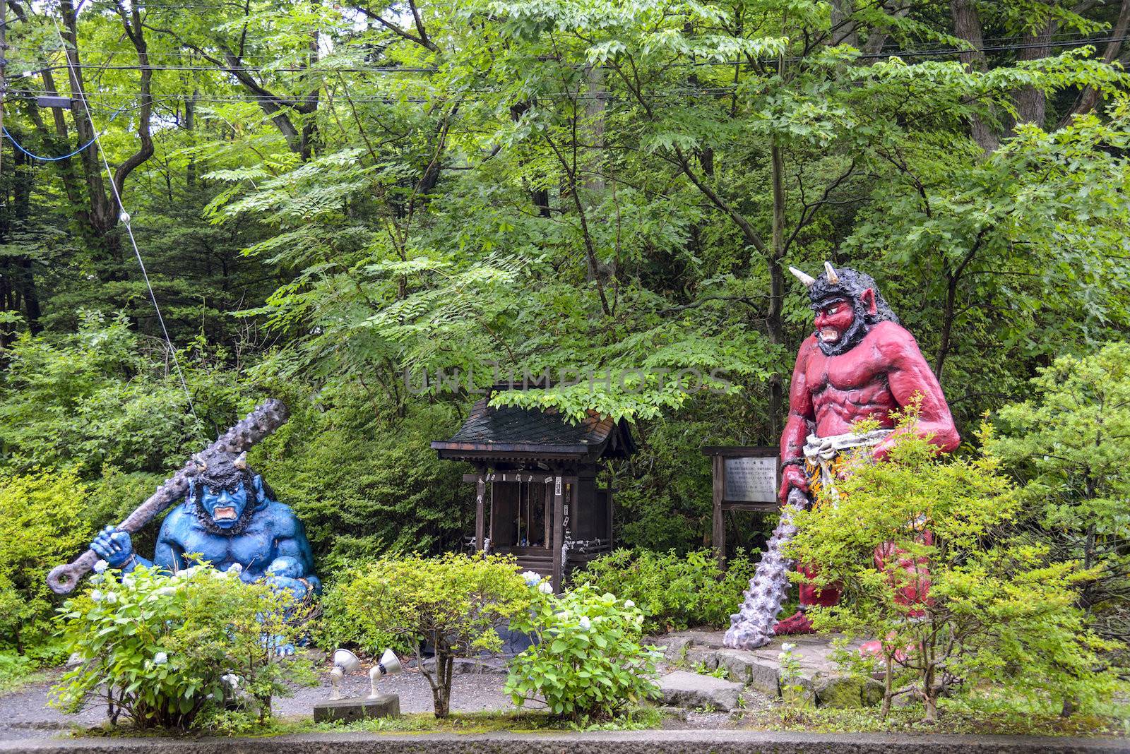 Two Giants stand  near the shrine
