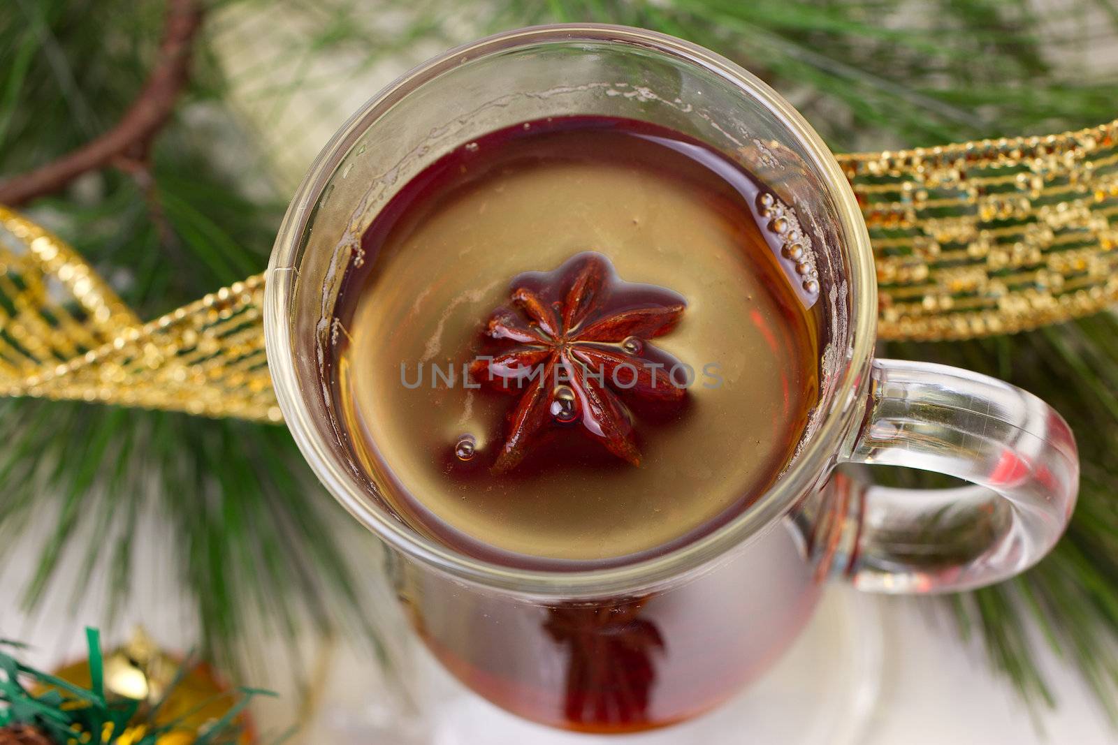 Christmas mug with tea decorated  with red and green snowflakes pine and fir cone ornament