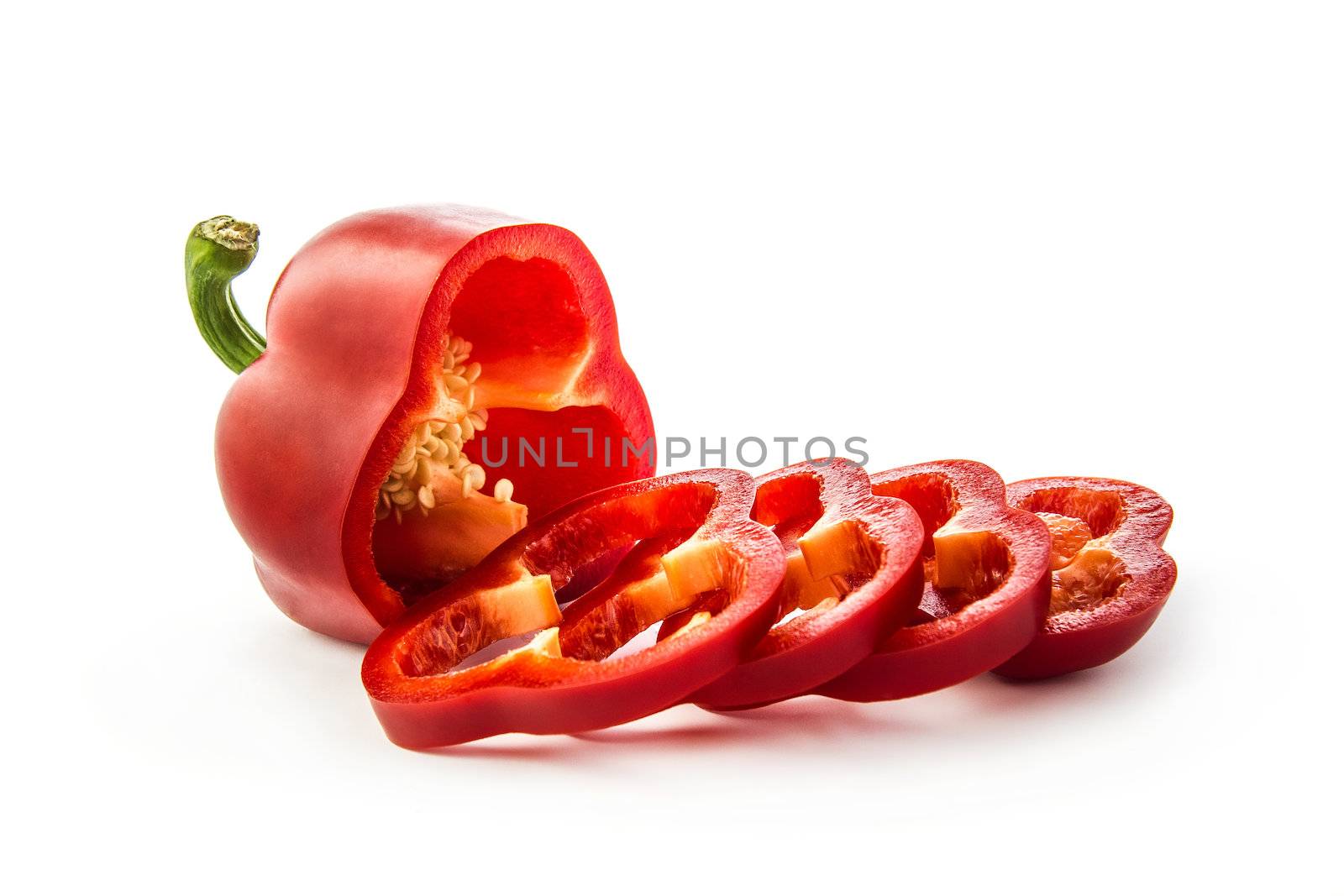 Sliced pepper on white by dynamicfoto
