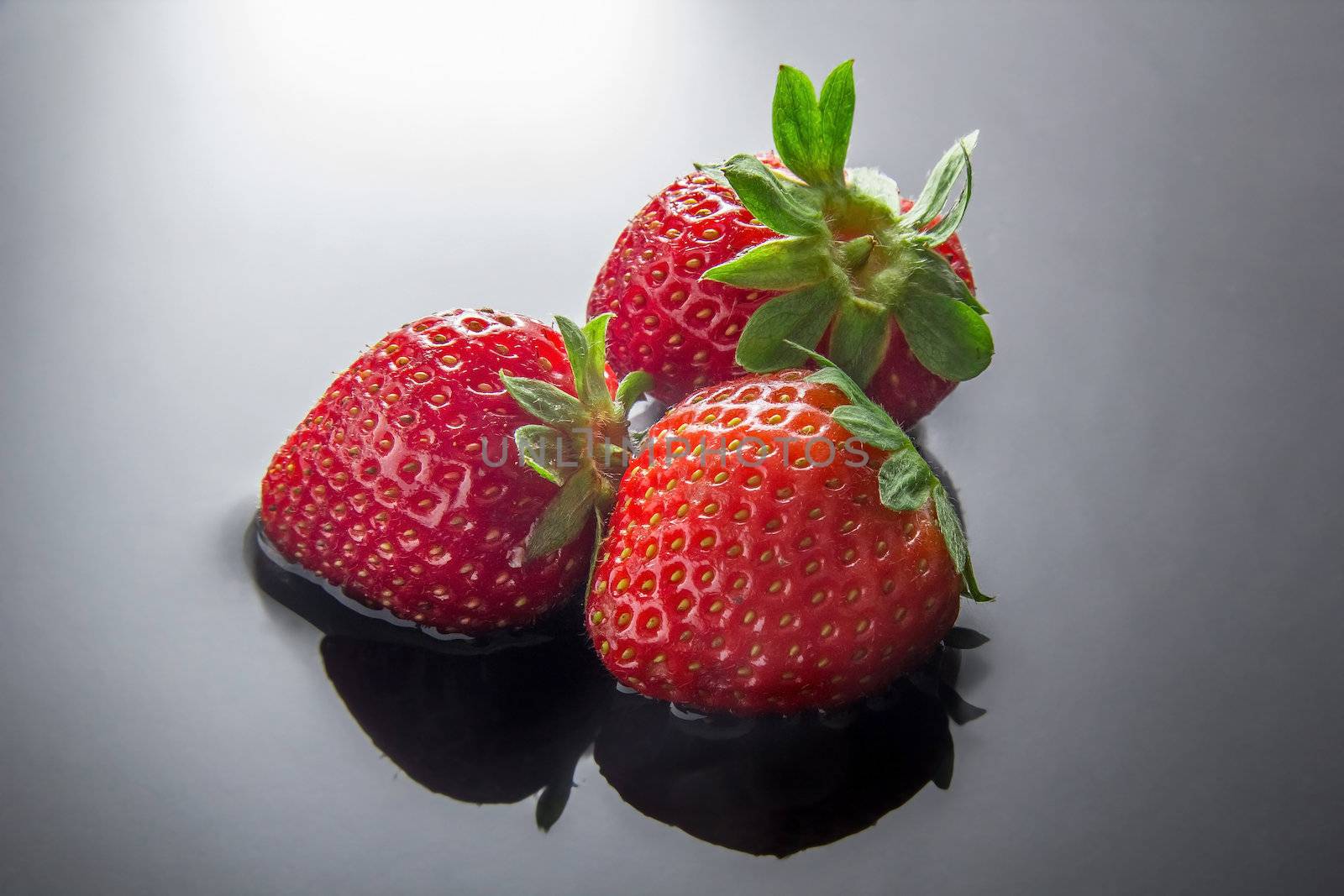Strawberries on water by dynamicfoto