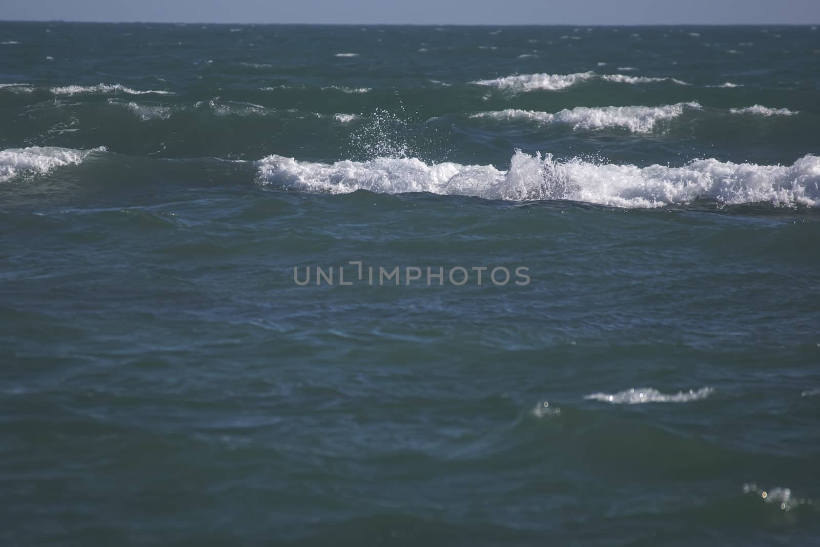 The sea and the sky, the white waves, black rocks, very beautiful