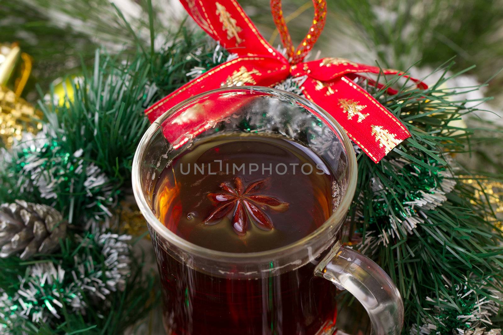 Christmas mug with tea decorated  with red and green snowflakes pine and fir cone ornament