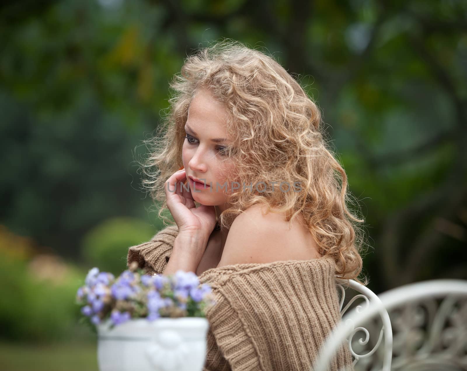 young beautiful woman is resting in the garden