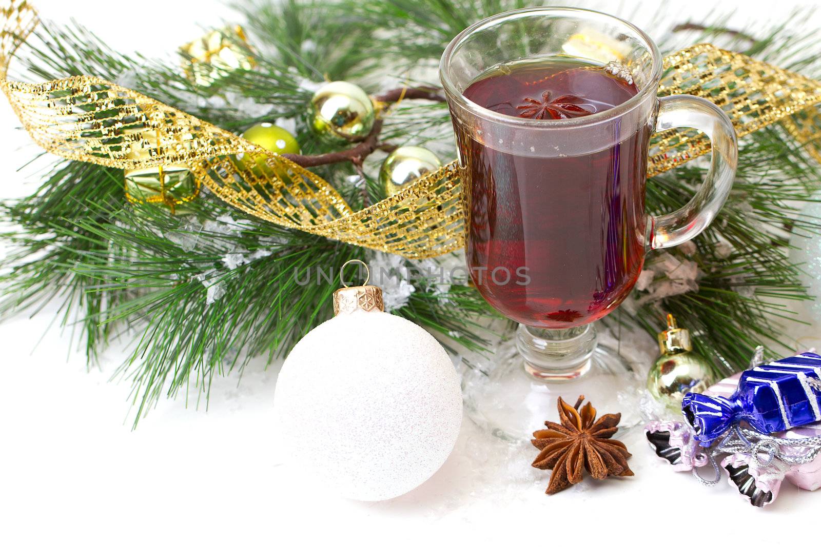 Christmas mug with tea decorated  with red and green snowflakes pine and fir cone ornament