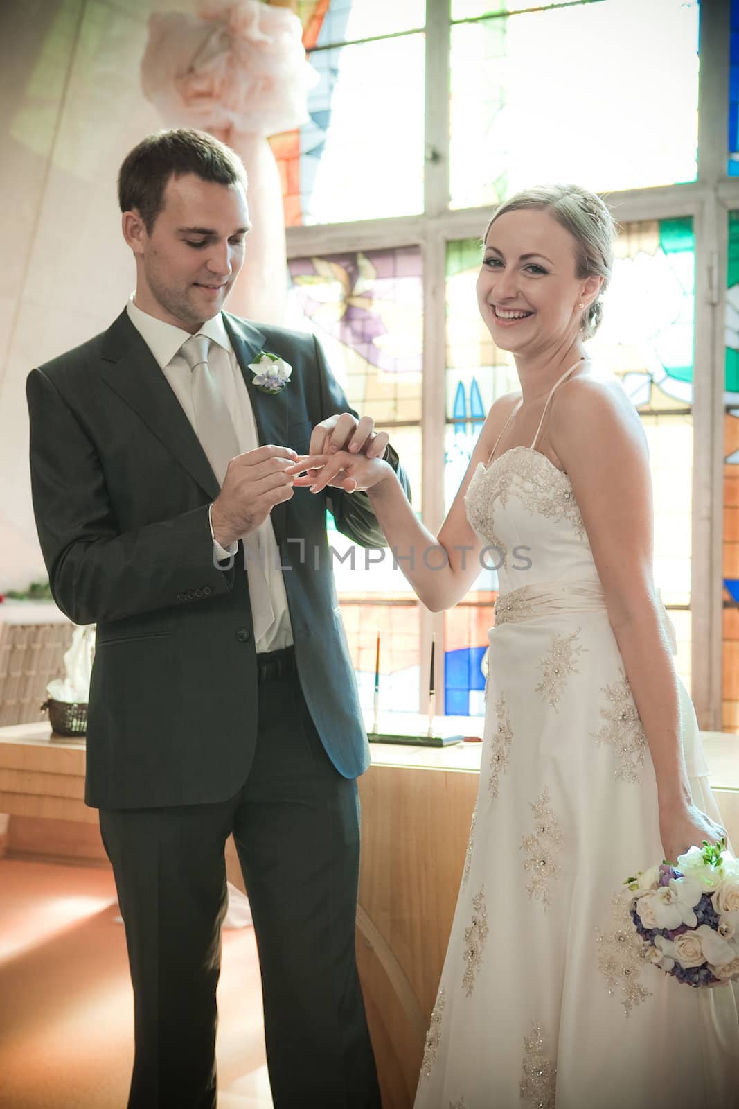 Beautiful bride in white with handsome groom on wedding day