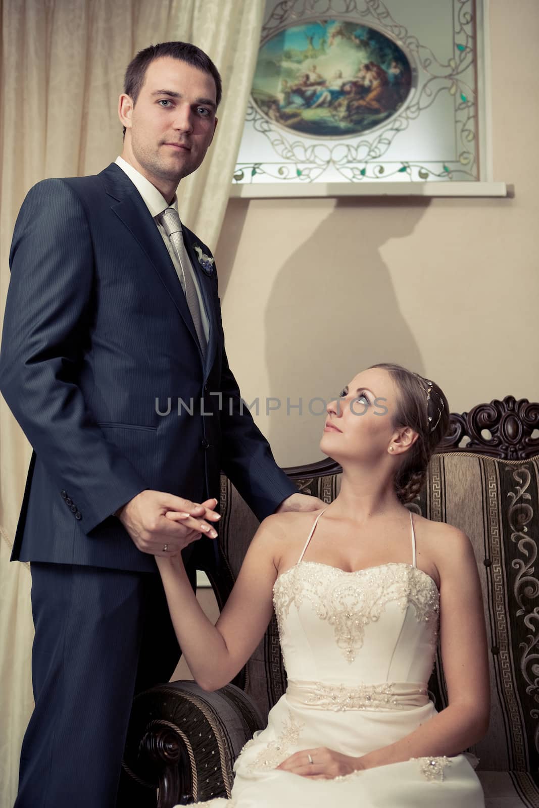 Beautiful bride in white with handsome groom on wedding day