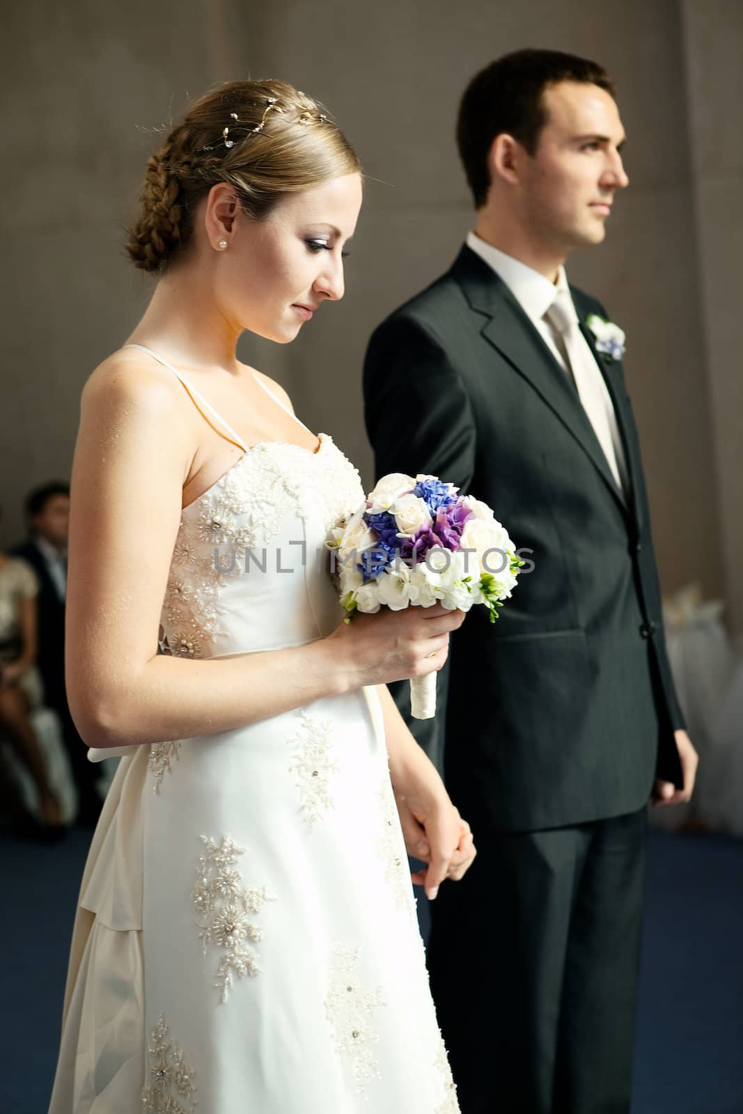 Beautiful bride in white with handsome groom on wedding day