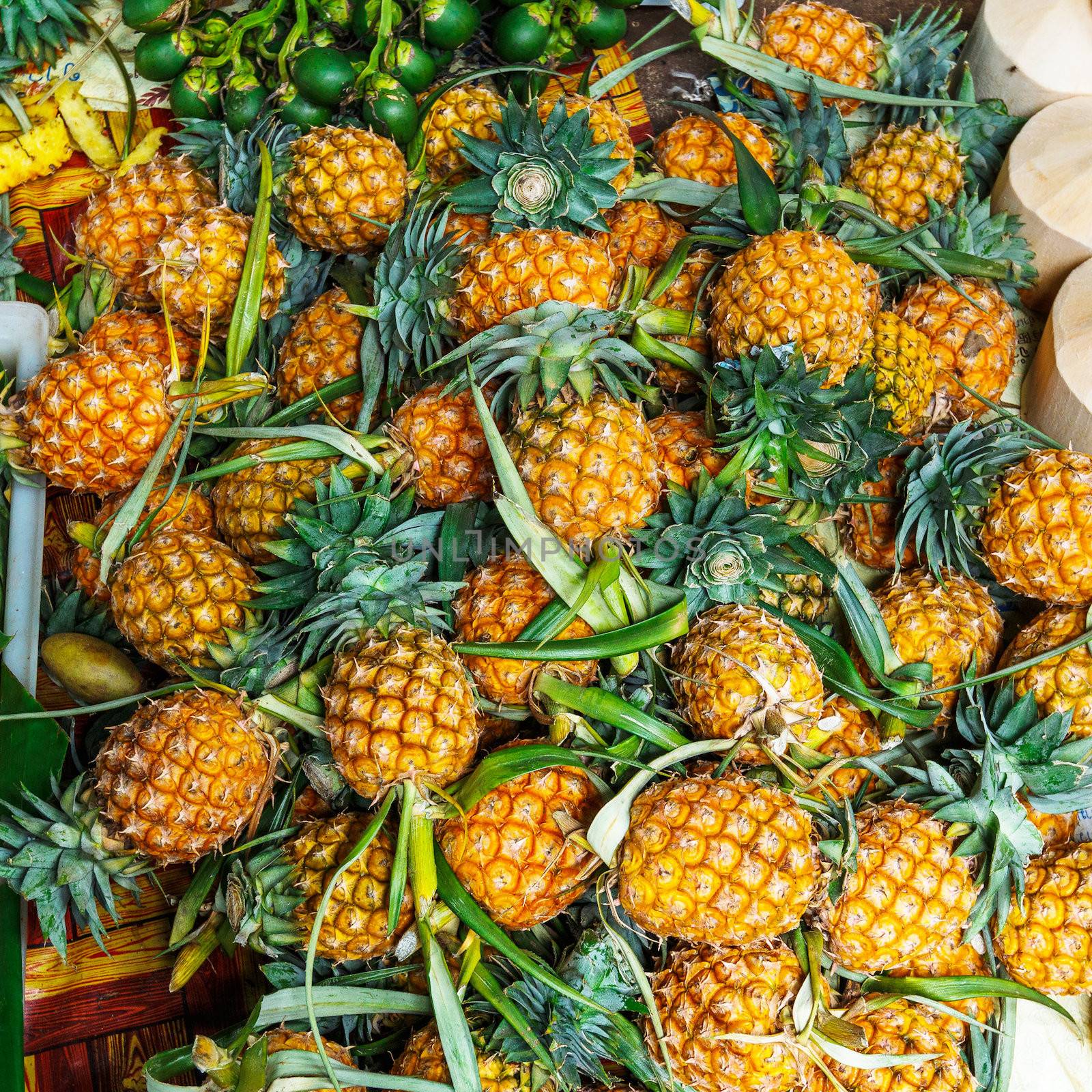 Fresh pineapples in fresh fruit market by leungchopan