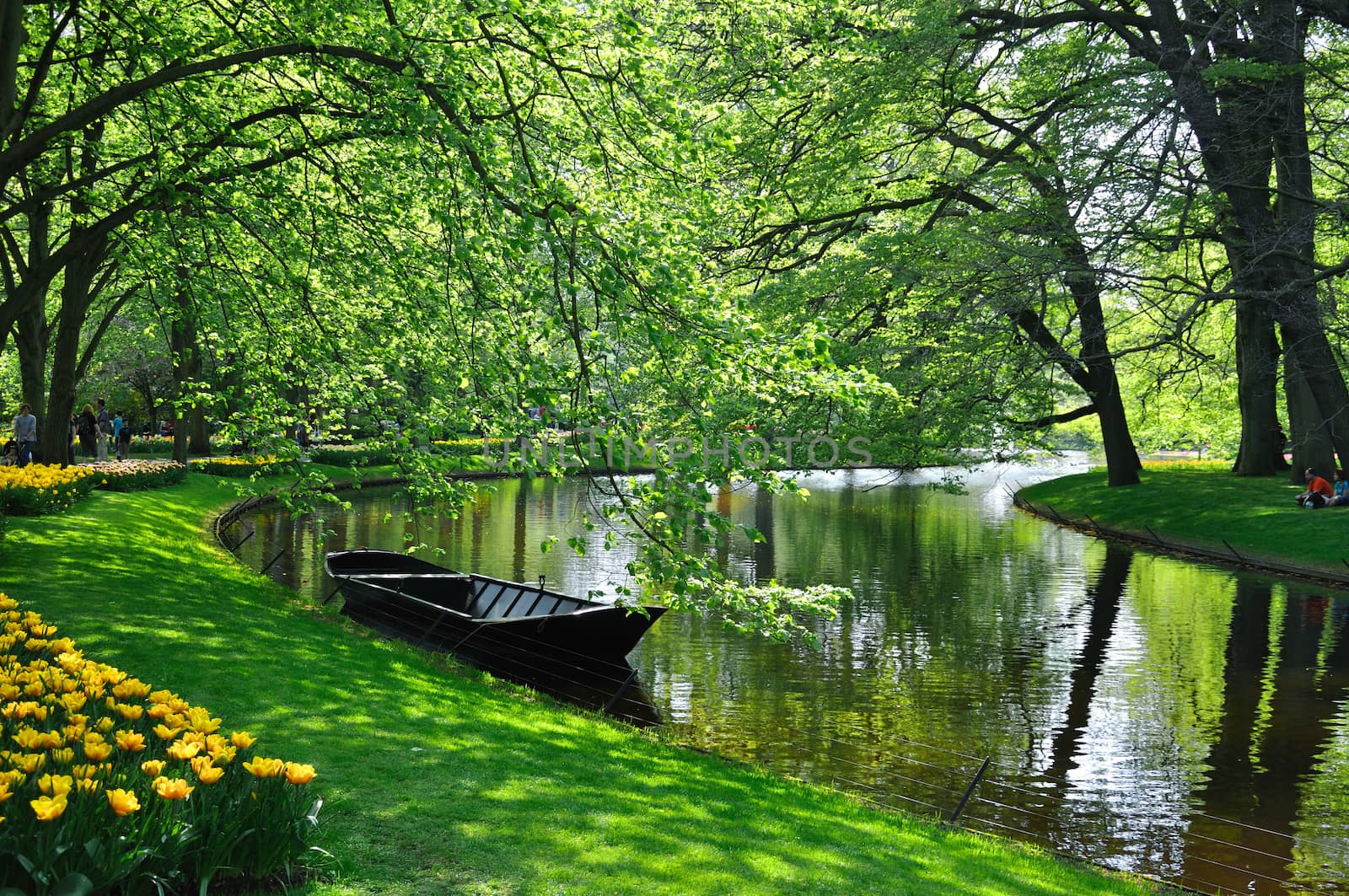 Boat near the river in Keukenhof park in Holland by Eagle2308