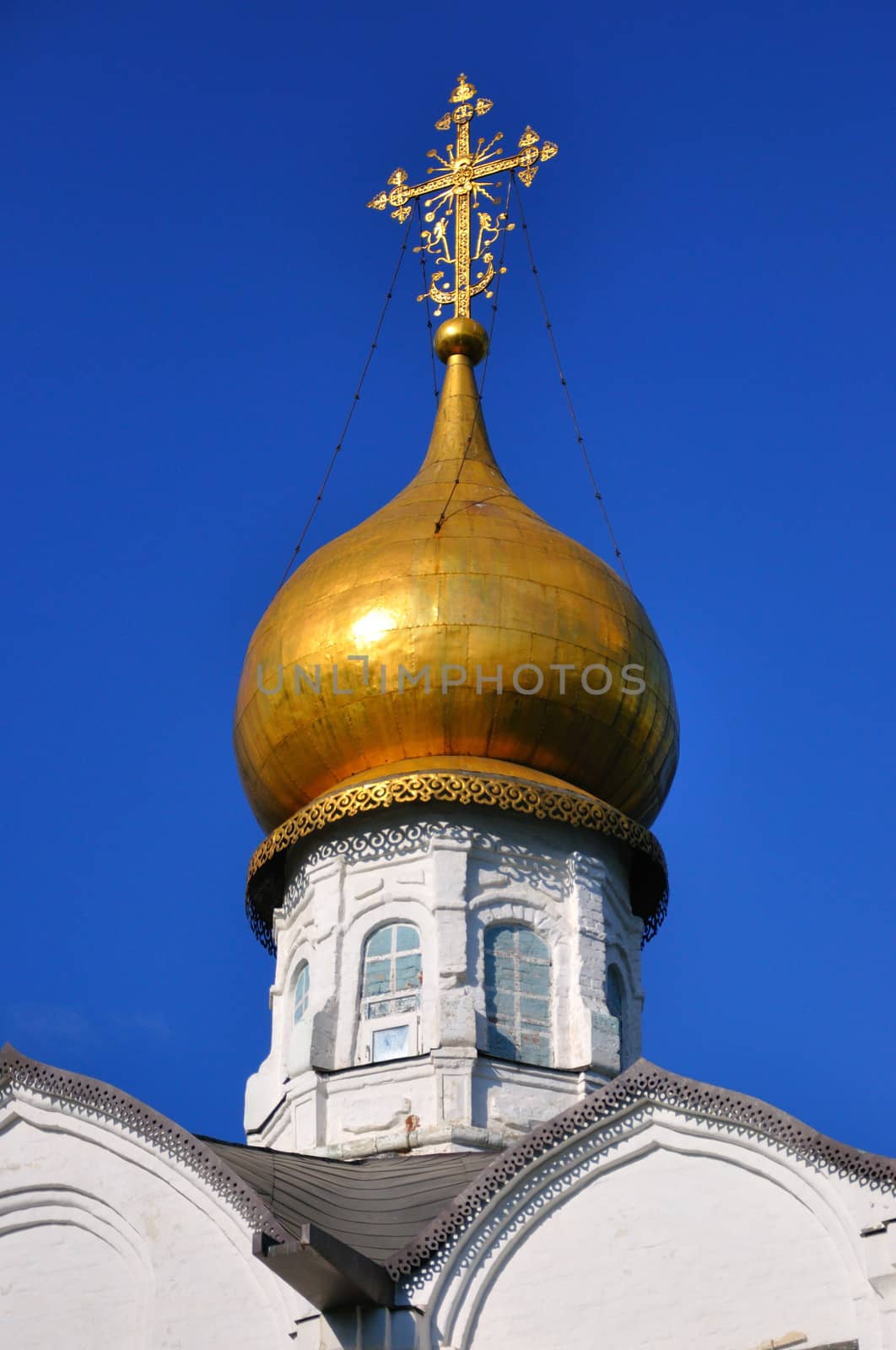 White orthodox church with a golden dome, Sergiev Posad, Moscow region, Russia