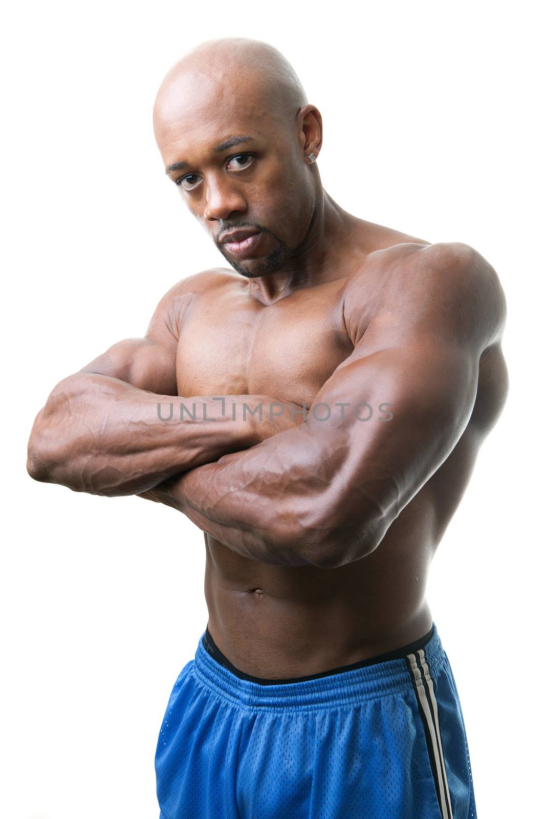 Toned and ripped lean muscle fitness man isolated over a white background.