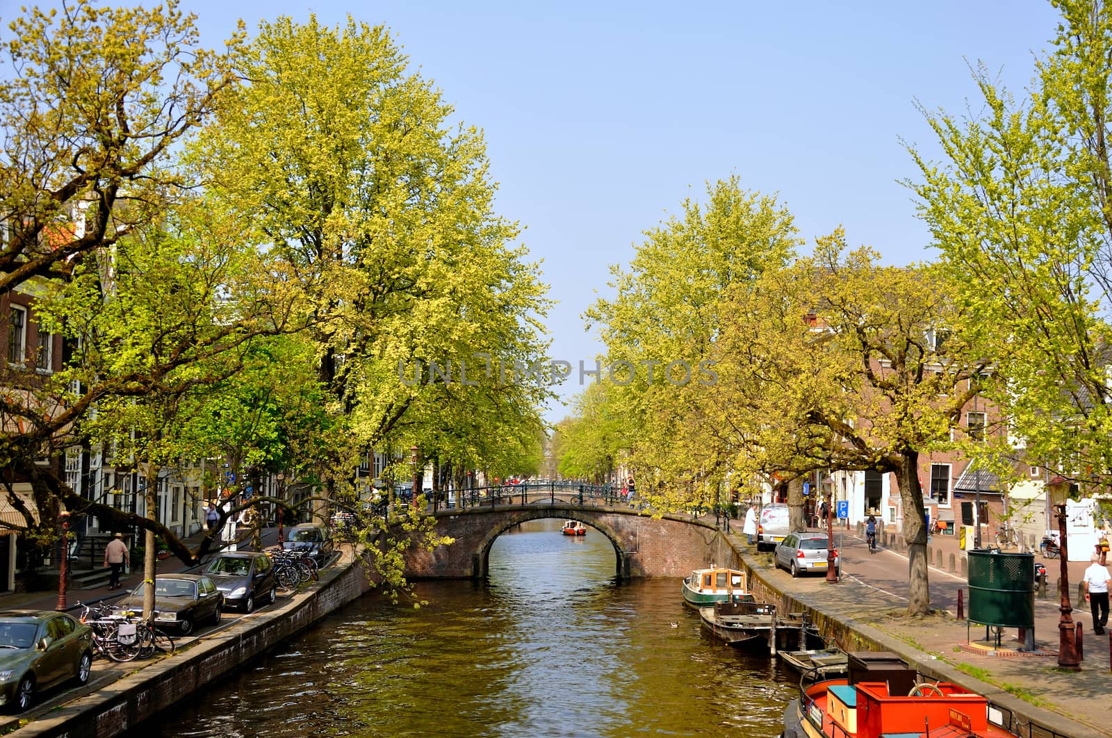 Beautiful river with boats and bridge in Amsterdam, Holland (Netherlands)