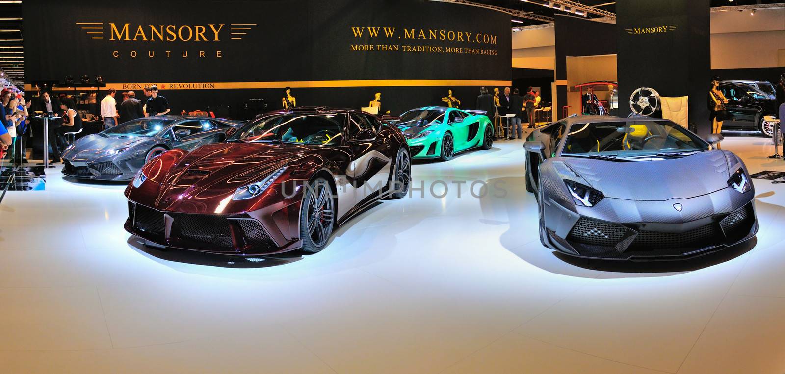 FRANKFURT - SEPT 14: Ferrari Mansory 458 Italia and Lamborghini Aventador Carbonado by Mansory presented as world premiere at the 65th IAA (Internationale Automobil Ausstellung) on September 14, 2013 in Frankfurt, Germany