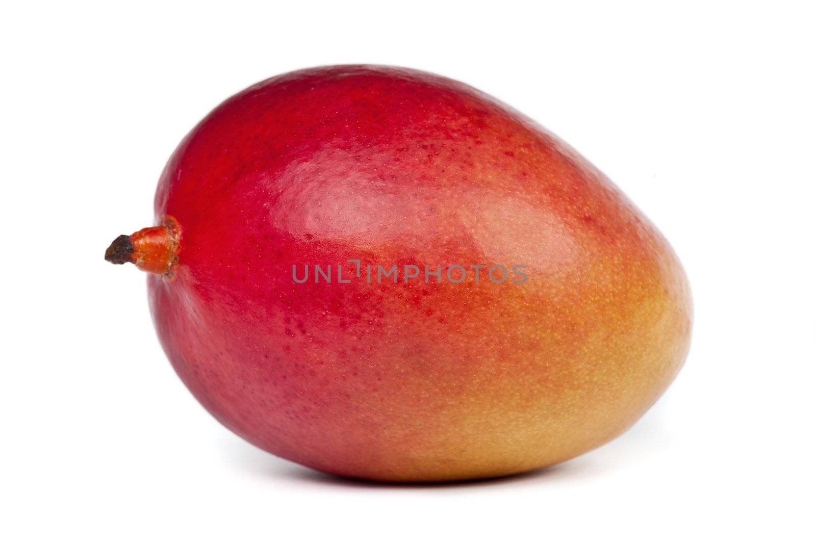 Whole ripe and juicy mango on white background