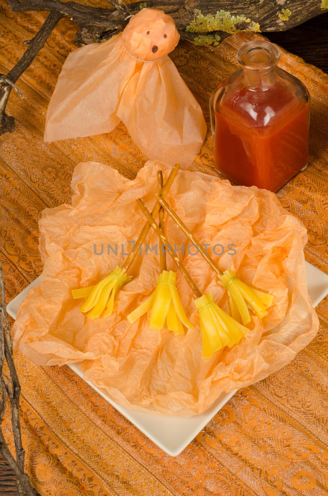 Halloween party snack decorated for children, cheese broomsticks