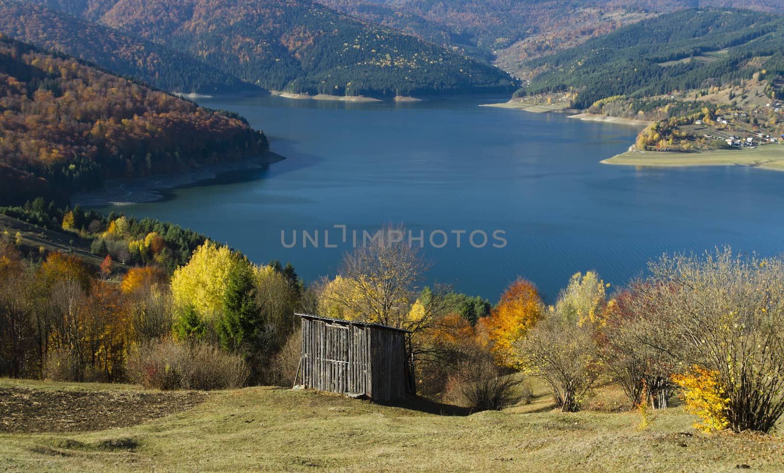 Autumn rural mountain landscape with lake, Romanian Carpathians