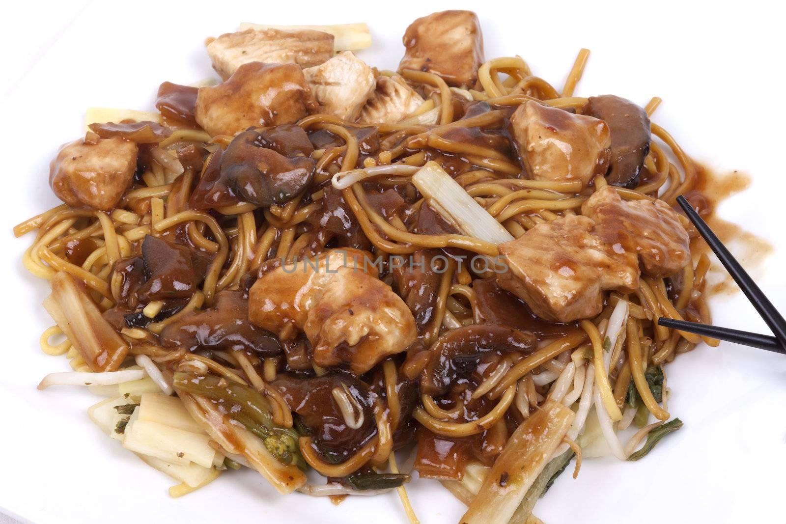 cooked noodles with pieces of chicken breast and vegetables in savoury mushroom sauce