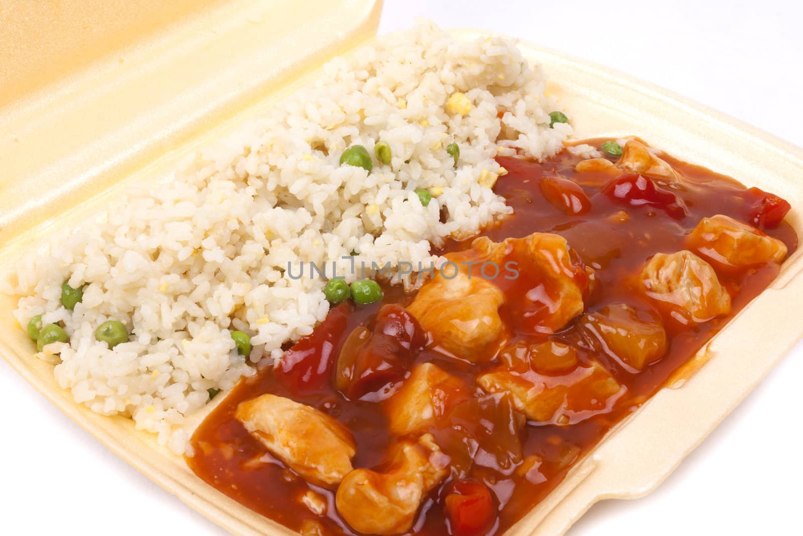 Closeup photo of take away chinese sweet and sour chicken with rice.