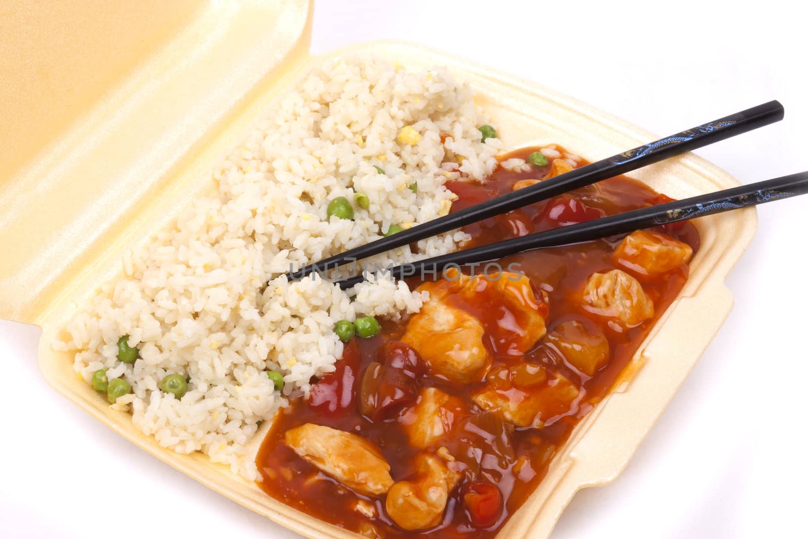 Closeup photo of take away chinese sweet and sour chicken with rice.