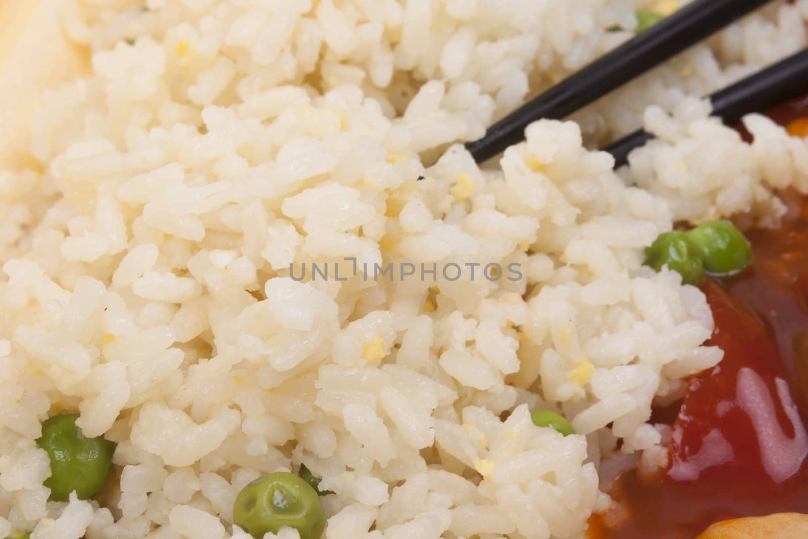 Closeup photo of chinese sweet and sour chicken with rice.