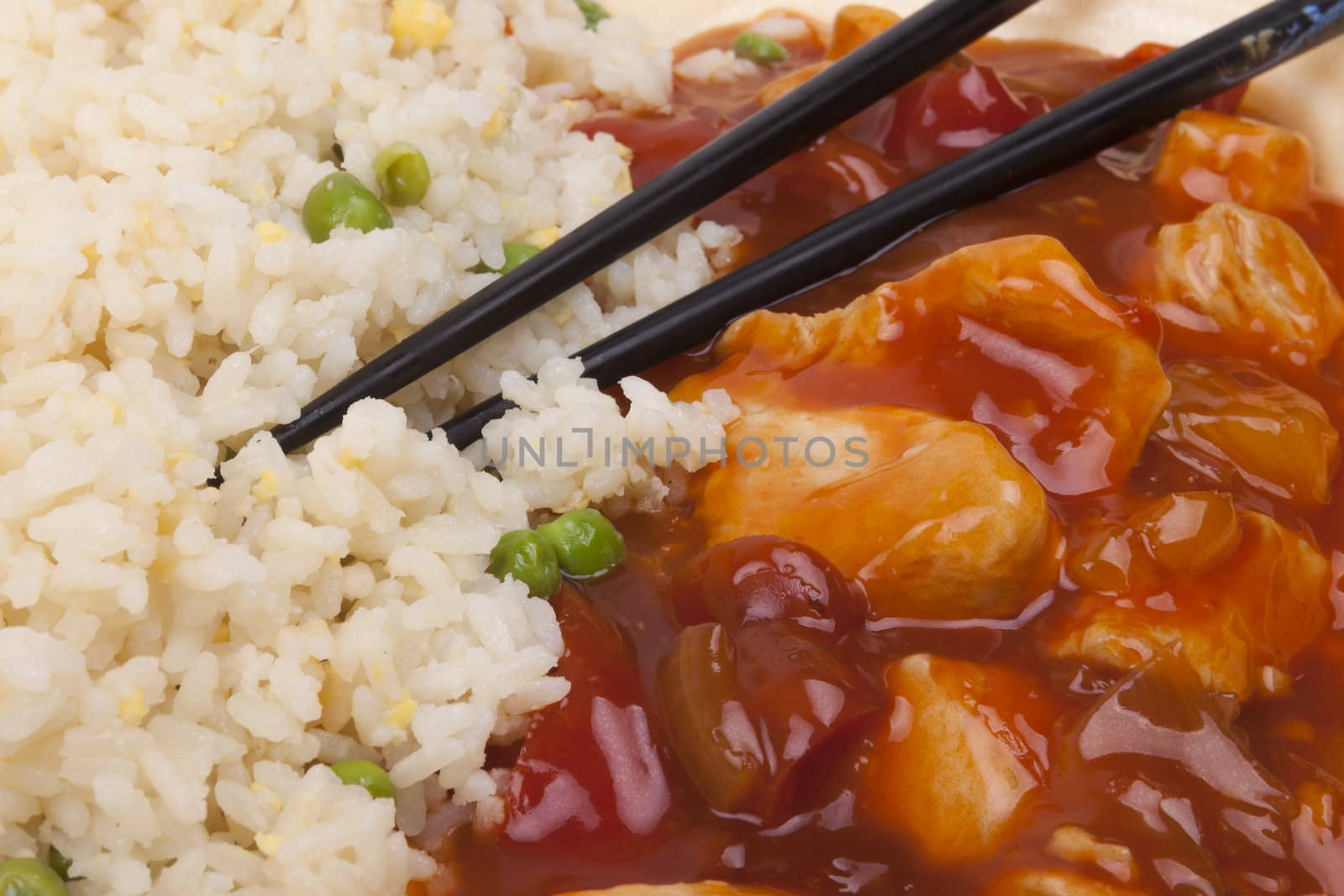 Closeup photo of chinese sweet and sour chicken with rice.