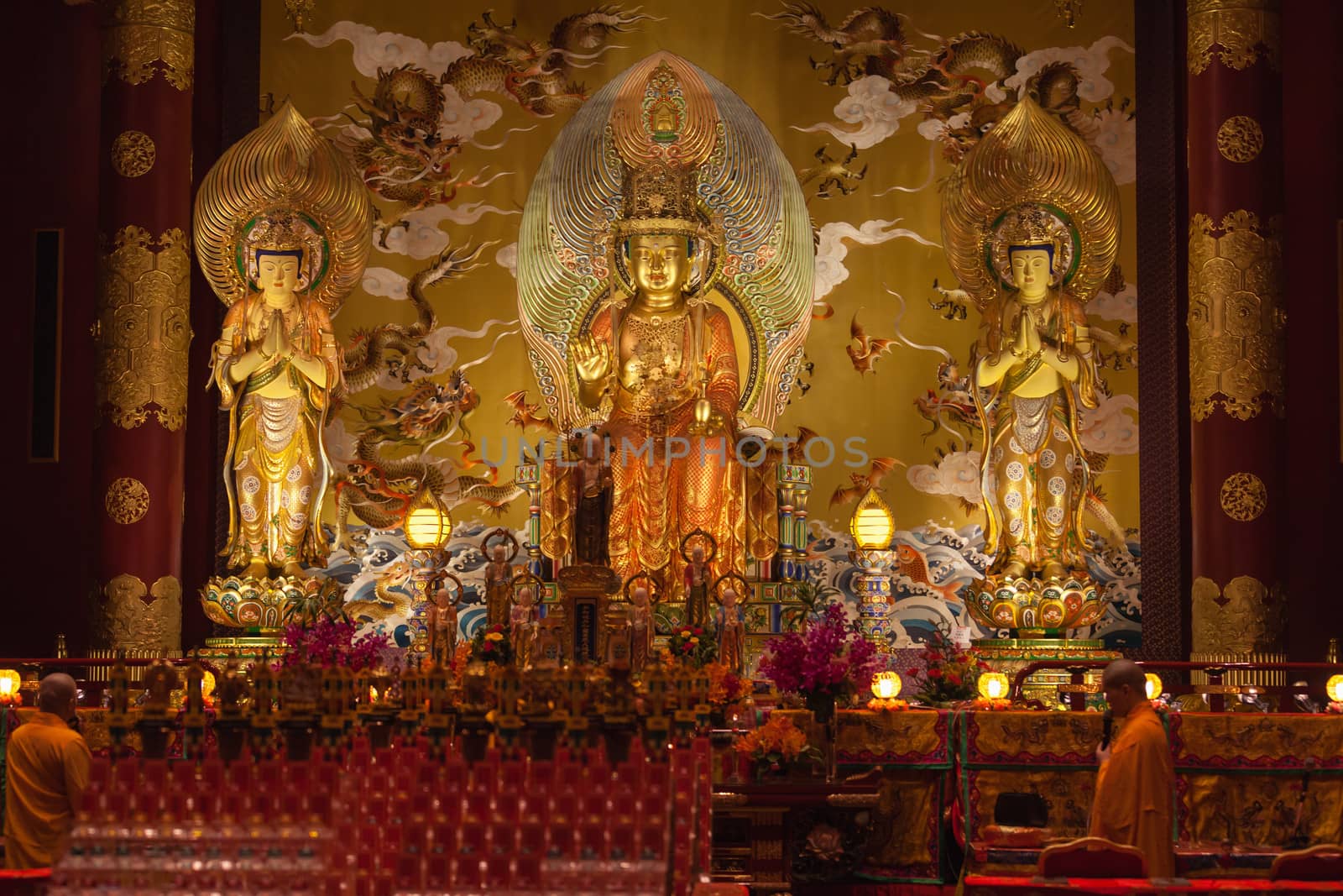 SINGAPORE - SEP 08: Monk chanting in Buddha tooth relic temple on Sep 08, 2013 in Singapore. Since opening in 2007, the temple has become a popular attraction within Chinatown.