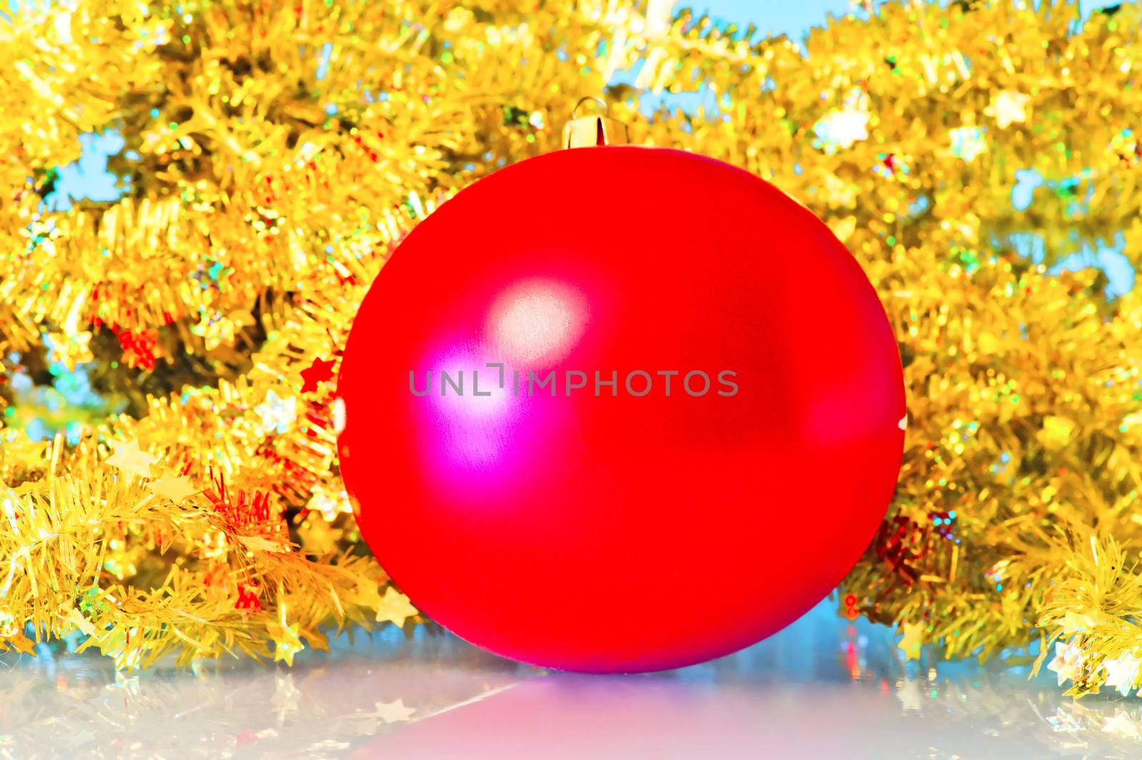 Red Christmas ball in a golden tinsel by kosmsos111