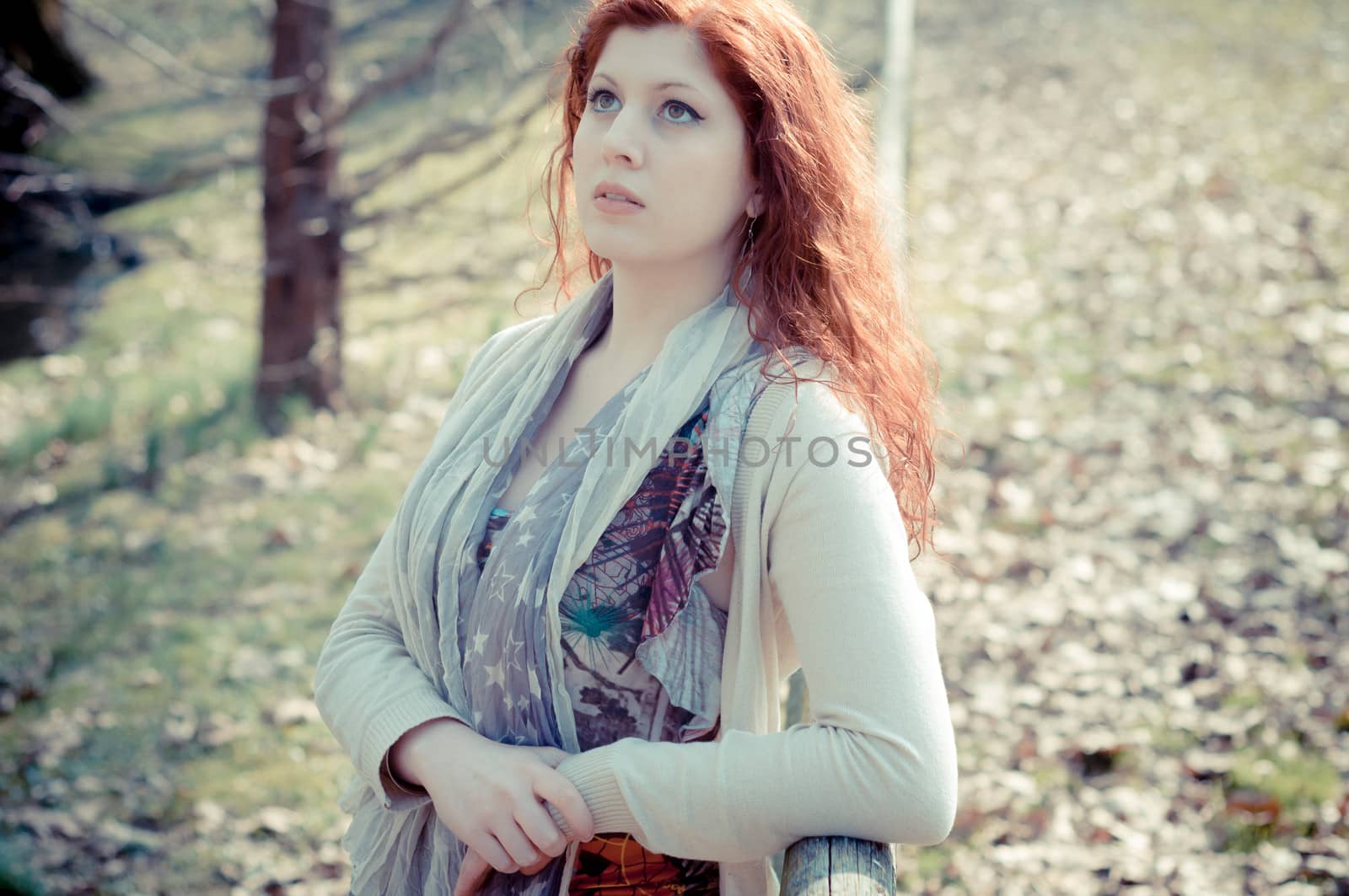 beautiful young woman posing in the park of the city