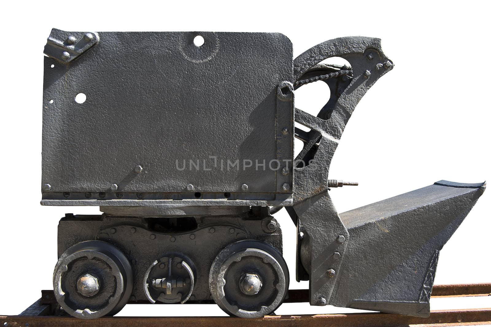 Old mine cart with wheels and rails with shovel on white background