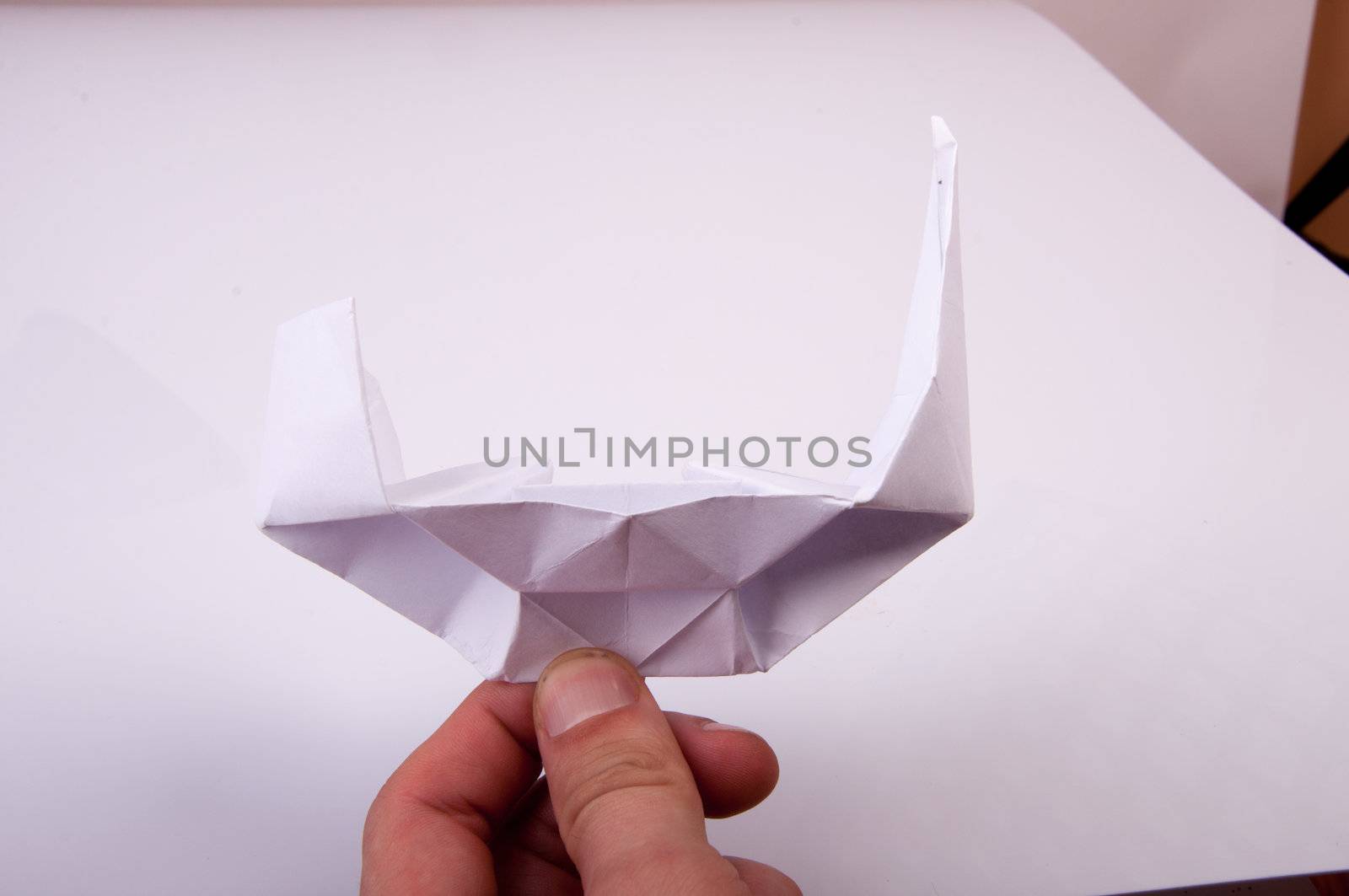An image of white origami boat 